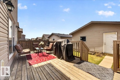 Expansive outdoor deck featuring wood-finish flooring and a wood railing - 18080 89 Street, Edmonton, AB - Outdoor With Deck Patio Veranda With Exterior