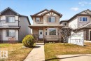 Two-story residence featuring light brown horizontal siding with decorative white and dark brown trim - 18080 89 Street, Edmonton, AB  - Outdoor With Facade 