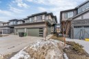 Modern multi-level residence featuring a two-car garage with frosted window panels - 6404 27 Avenue, Edmonton, AB  - Outdoor With Facade 