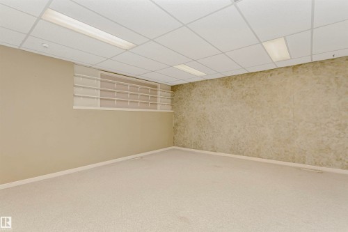 Spacious room featuring carpeting, recessed lighting, and built-in shelving - 24 Sable Crescent, St. Albert, AB - Indoor Photo Showing Other Room