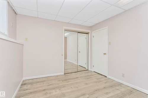 This room features light-colored walls, light-toned flooring, and a drop ceiling - 24 Sable Crescent, St. Albert, AB - Indoor Photo Showing Other Room
