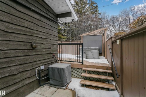 The property features an exterior with horizontal wood siding and an outdoor deck with a hot tub - 24 Sable Crescent, St. Albert, AB - Outdoor With Deck Patio Veranda With Exterior