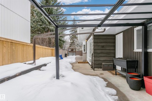 The property features a patio area with an overhead pergola structure, a wooden fence, and exterior siding - 24 Sable Crescent, St. Albert, AB - Outdoor With Exterior