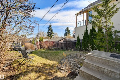 Expansive backyard featuring a partial lawn, mature trees, and privacy fencing - 9816 93 Avenue, Edmonton, AB - Outdoor