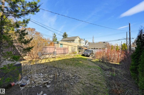 Expansive backyard with a sloped lawn and natural landscaping - 9816 93 Avenue, Edmonton, AB - Outdoor