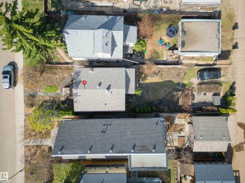 Aerial view showcasing multiple residential properties with varied rooflines and surrounding landscaping - 9816 93 Avenue, Edmonton, AB - Outdoor With View