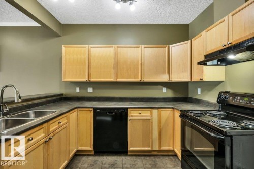 64 3040 Spence Wynd, Edmonton, AB - Indoor Photo Showing Kitchen With Double Sink