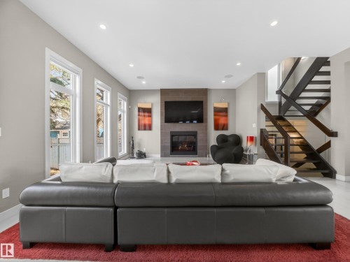 10650 66 Avenue, Edmonton, AB - Indoor Photo Showing Living Room With Fireplace