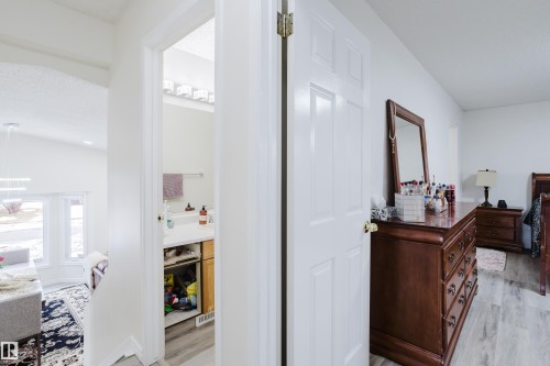 Bright white interior walls with contrasting wood-finish flooring - 236 Lago Lindo Crescent, Edmonton, AB - Indoor Photo Showing Other Room