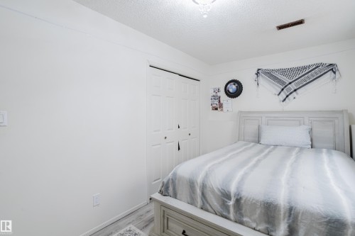Bedroom featuring white walls and a light wood-finish bed frame - 236 Lago Lindo Crescent, Edmonton, AB - Indoor Photo Showing Bedroom