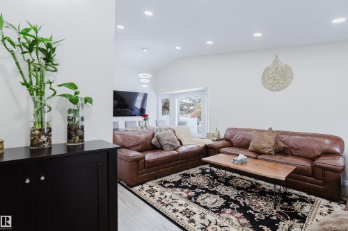 Open concept living area featuring recessed lighting, light-toned flooring, and a large window - 236 Lago Lindo Crescent, Edmonton, AB - Indoor Photo Showing Living Room