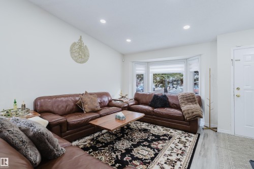 Living room with light wood-finish flooring and recessed lighting - 236 Lago Lindo Crescent, Edmonton, AB - Indoor Photo Showing Living Room