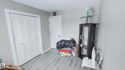 Light wood-finish flooring complements the neutral wall color - 3311 108 Street, Edmonton, AB - Indoor