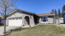 Ranch-style exterior with a two-car garage, arched entry, and a prominent chimney - 3311 108 Street, Edmonton, AB  - Outdoor 