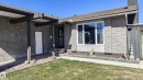 Mid-century modern facade featuring textured stucco, a covered entry, and a large multi-pane window - 3311 108 Street, Edmonton, AB  - Outdoor 