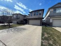 Contemporary two-story residence featuring a stone and siding facade, a two-car garage, and a concrete driveway - 3538 Claxton Crescent, Edmonton, AB  - Outdoor With Facade 