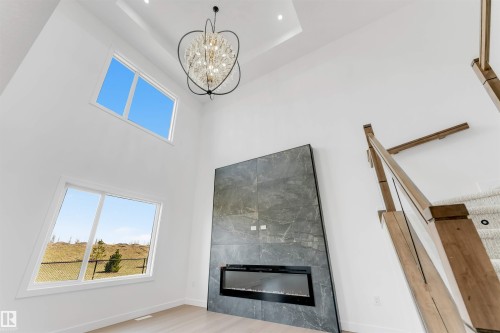 138 Creekside Lane Lane, Leduc, AB - Indoor With Fireplace