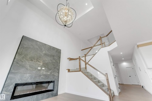 138 Creekside Lane Lane, Leduc, AB - Indoor With Fireplace
