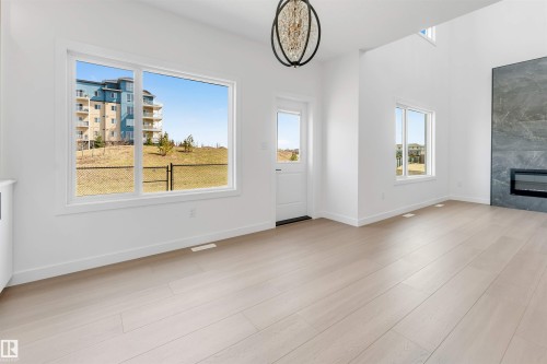 138 Creekside Lane Lane, Leduc, AB - Indoor With Fireplace