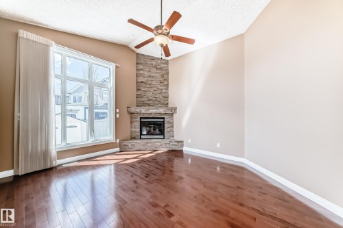 1221 Cunningham Drive, Edmonton, AB - Indoor Photo Showing Other Room With Fireplace