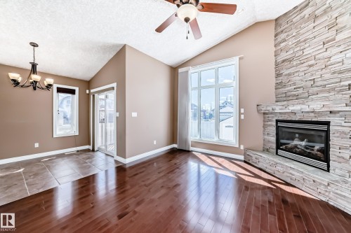 1221 Cunningham Drive, Edmonton, AB - Indoor Photo Showing Living Room With Fireplace