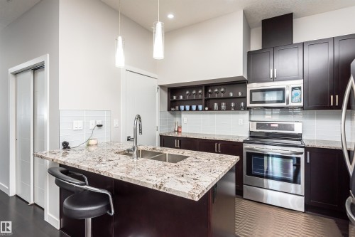 404 10238 103 Street, Edmonton, AB - Indoor Photo Showing Kitchen With Stainless Steel Kitchen With Double Sink With Upgraded Kitchen