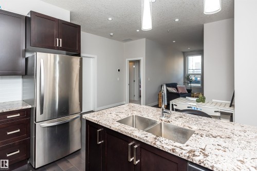 404 10238 103 Street, Edmonton, AB - Indoor Photo Showing Kitchen With Stainless Steel Kitchen With Double Sink With Upgraded Kitchen