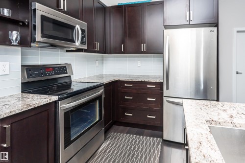 404 10238 103 Street, Edmonton, AB - Indoor Photo Showing Kitchen With Stainless Steel Kitchen With Upgraded Kitchen