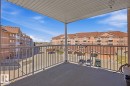 Concrete balcony with metal railings and a textured overhead soffit - 304 4312 139 Ave, Edmonton, AB  - Outdoor With Balcony With Exterior 
