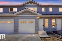 Contemporary exterior featuring horizontal siding, white trim, and a prominent gable roofline - 