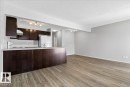 Open-concept living area featuring wood-finish flooring - #7 18004 89 St Nw, Edmonton, AB  - Indoor Photo Showing Kitchen 