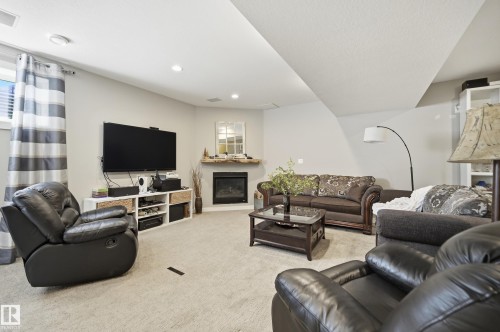 77 Richmond Link, Fort Saskatchewan, AB - Indoor Photo Showing Living Room With Fireplace