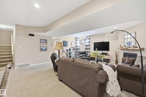 77 Richmond Link, Fort Saskatchewan, AB - Indoor Photo Showing Living Room With Fireplace