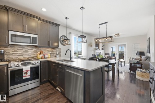 77 Richmond Link, Fort Saskatchewan, AB - Indoor Photo Showing Kitchen With Double Sink With Upgraded Kitchen