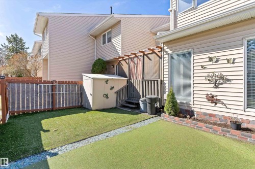 Private outdoor area featuring artificial turf and a gravel border - 6734 36A Avenue, Edmonton, AB 