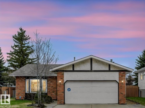 Brick and stucco exterior with an integrated garage - 4011 104 Street, Edmonton, AB - Outdoor