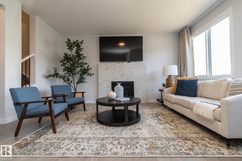 1448 Darby Green Green, Edmonton, AB - Indoor Photo Showing Living Room With Fireplace