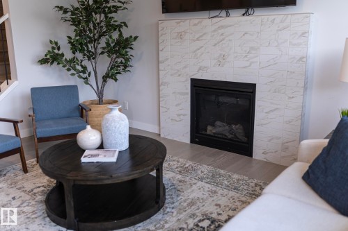 1448 Darby Green Green, Edmonton, AB - Indoor Photo Showing Living Room With Fireplace