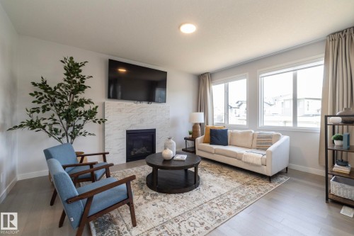 1448 Darby Green Green, Edmonton, AB - Indoor Photo Showing Living Room With Fireplace