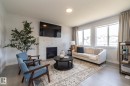 1448 Darby Green Green, Edmonton, AB  - Indoor Photo Showing Living Room With Fireplace 