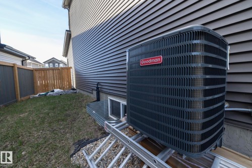 Goodman brand exterior air conditioning unit alongside the property - 1448 Darby Green Green, Edmonton, AB - Outdoor
