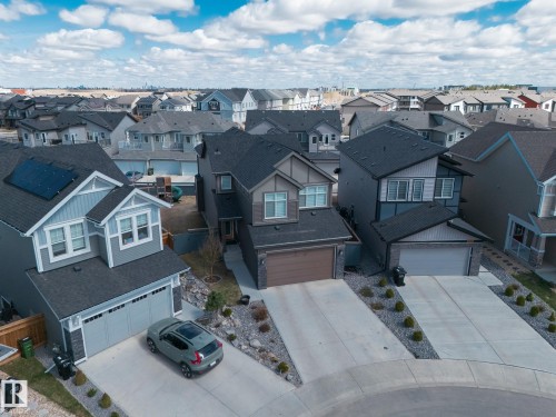 Modern residential neighborhood featuring multiple detached homes with varying architectural styles - 1448 Darby Green Green, Edmonton, AB - Outdoor With Facade