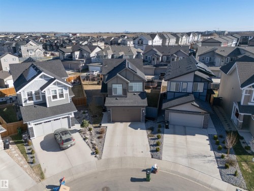 Modern residential architecture featuring a two-story design and an attached garage - 1448 Darby Green Green, Edmonton, AB - Outdoor With Facade