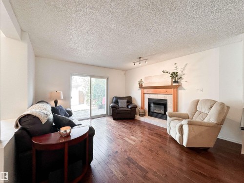 10020 97 Avenue, Edmonton, AB - Indoor Photo Showing Living Room With Fireplace