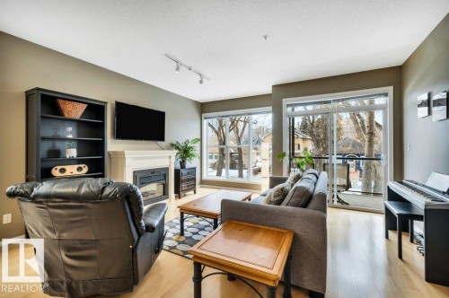 201 11025 83 Avenue, Edmonton, AB - Indoor Photo Showing Living Room With Fireplace
