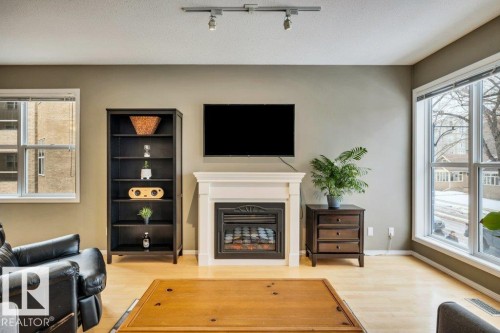 201 11025 83 Avenue, Edmonton, AB - Indoor With Fireplace