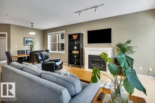 201 11025 83 Avenue, Edmonton, AB - Indoor Photo Showing Living Room With Fireplace