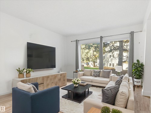 108 5730 Riverbend Road, Edmonton, AB - Indoor Photo Showing Living Room