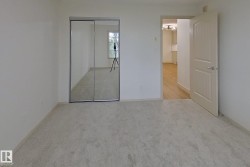 Neutral wall finishes complement the light gray carpet flooring - 