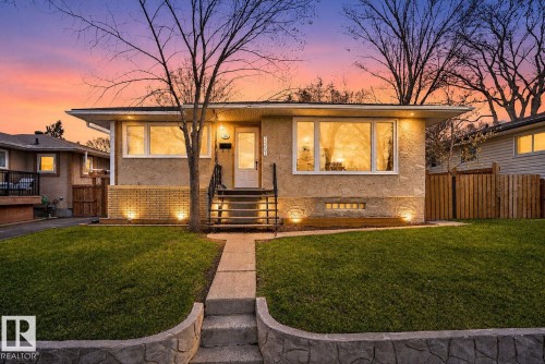 Stucco exterior with a brick-clad foundation - 10409 83 Street, Edmonton, AB - Outdoor